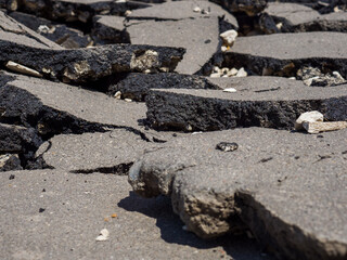 The consequences of the earthquake. Swollen broken asphalt.