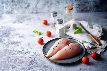 Raw fresh chicken breast in a plate