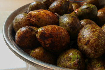 Matoa fruits from Papua Indonesia in the bowl. Unique and rare fruit.