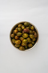 Matoa fruits from Papua Indonesia in the bowl on the white background. Unique and rare fruit.