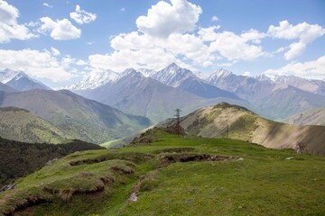 Fototapeta na wymiar Landscapes of the Caucasian mountains from the headwaters of the Dzheyrakh gorge. The Republic of Ingushetia. Russia