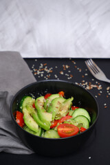 Vegetable salad with avocado, tomatoes, cucumbers. Food. Cooking.