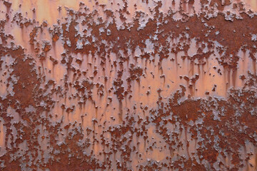 Red painted steel with rusty spots and cracks, grunge rusted metal texture
