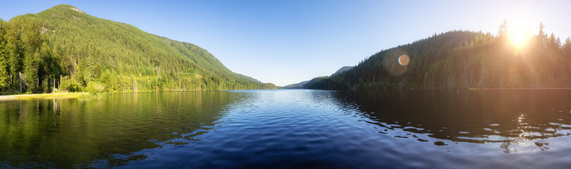 Panoramic View of Buntzen Lake surrounded by Canadian Mountain Landscape. Sunny Summer Evening....