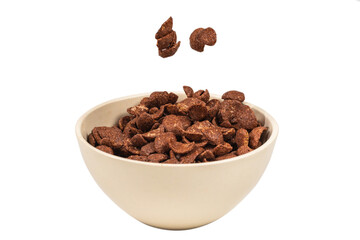 Chocolate corn flakes falling to the white bowl isolated on white. Motion.