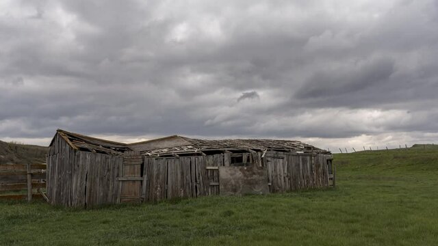 Timelapse of an old abandoned farm buildings. 