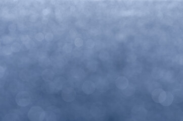 abstract blue bokeh glitter sparkle background.