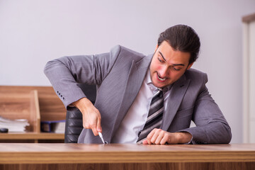 Young businessman employee sitting in the office