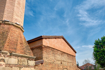 Bursa, Nicaea (iznik), Turkey. Old church of Hagia sophia and now mosque established by orthodox byzantium and converted by Ottoman Empire to mosque. entrance gate and wall made red bricks
