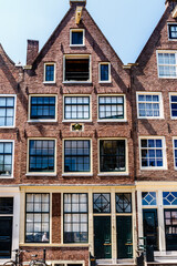 Fototapeta na wymiar 17th century houses at Zandhoek - Realeneiland, Amsterdam, Noord-Holland, The Netherlands, Europe