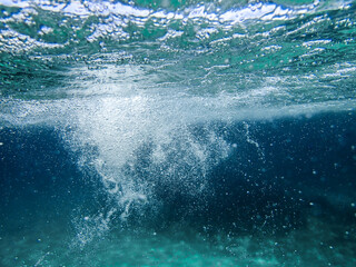 Bubbles under the sea in the crystal clear green sea water. Mediterranean bubbles. Real image very...