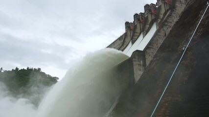 waterfall from the dam on a rainy day.Slow-motion, Medium shots - Powered by Adobe