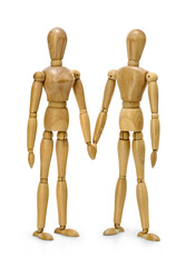 pair of wooden mannequins holding hands