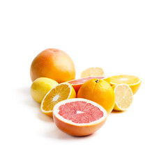 Grapefruits, oranges and lemons on a white background. Isolated..