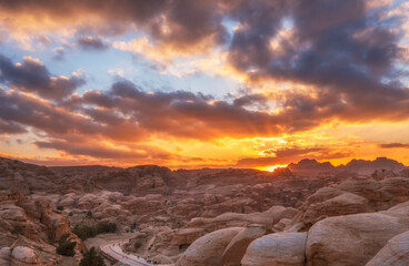Fototapeta na wymiar Sunset in the desert in ancient city of Petra in Jordan.