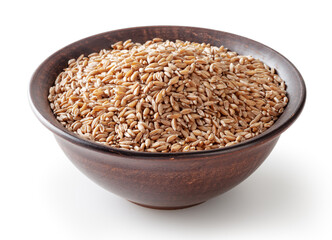 Grains of spelt in ceramic bowl isolated on white background wiht clipping path