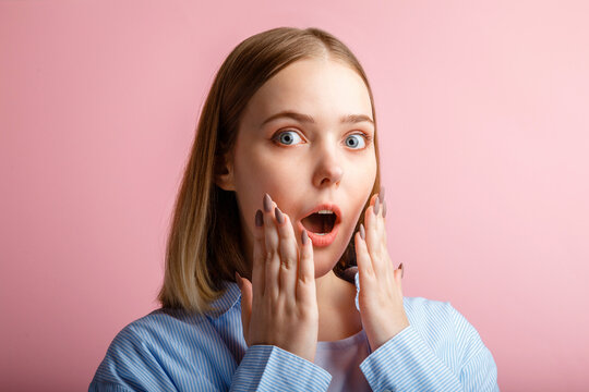 Emotional Portrait Of Surprised Business Woman With Open Mouth. Close Up Portrait Of Teenage Girl Student In Shirt Over Isolated Color Pink Background.