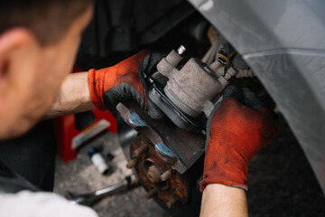 man working in the car workshop