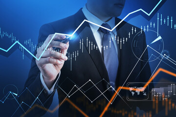 Financial graph showing increase of price in stock market, internet trading concept, Handsome trader in formal suit noting the spot on chart by pen. Forex. Double exposure