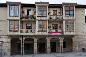 Fototapeta na wymiar Beautiful houses with balconies looking to the main square in Medina de Pomar, Merindades, Burgos, Spain, Europe