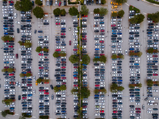  Beautiful cinematic aerial zenith view of a shopping mall parking lot full of cars © Gian