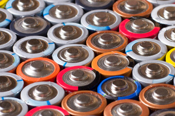 multiple stacked aaa batteries of different color and manufacturer