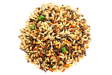 Food for canaries, parrots, finches, top view. Mixed seeds for bird feeding on white background. Food for exotic birds isolated on white background, top view. Mix for feeding canaries, parrots.