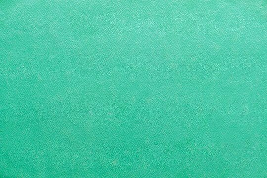 A Light Green Textured Background Of An Old Book