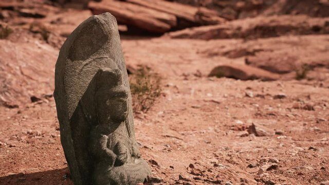 Ancient Statue on the Rocks Desert