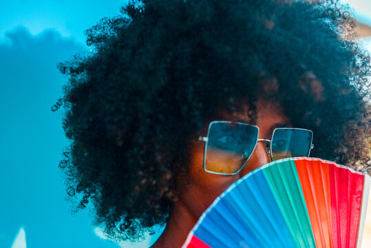 Black Young Beautiful Person Holding A Rainbow Colored Fan. Lgbtq+ Community Concept