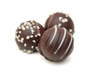 Chocolate candies collection. Beautiful Belgian truffles isolated on white background