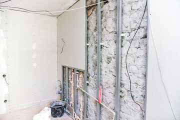 Renovation inside a residential building, installation of plasterboard on walls and ceilings without painting