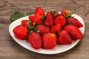 Ripe sweet strawberry with leaf