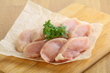 Raw chicken breast slices for cooking