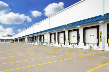 Exterior of warehouse industrial building with semi truck loading dock - obrazy, fototapety, plakaty