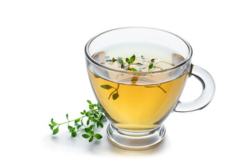 Green tea with lemon balm herb in glass cup isolated on white