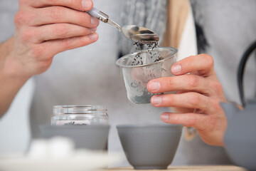 woman hands preparing hot tea