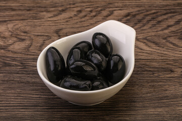 Pickled black olives in the bowl