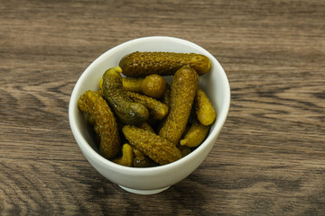 Pickled gherkin in the bowl