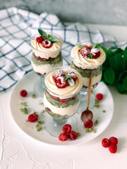 Obraz na płótnie Canvas Sweet homemade trifle dessert with raspberries and cream cheese.