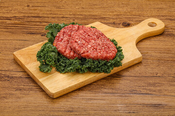 Raw beef burger cutlet for cooking