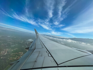 Fototapeta na wymiar Beautiful first person view of a plane window