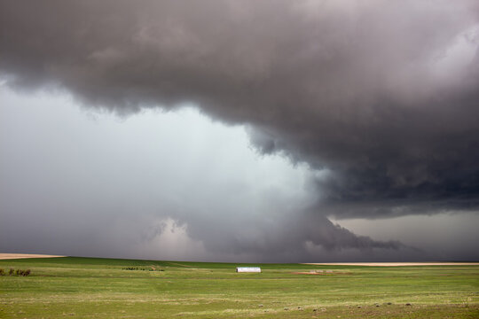 A wall cloud and tail cloud gather underneath a supercell thunderstorm on the high plains of eastern Colorado.