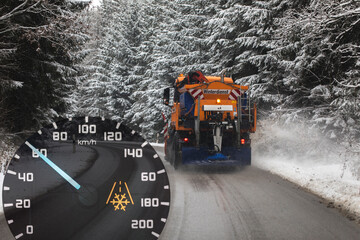 snow plow, winter service on a wet road, winter service truck driving on asphalt road at day while...