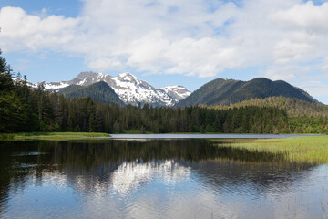 Fototapeta na wymiar Mountain landscape and reflection in lake