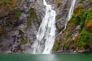 Waterfall in fjord in Alaska