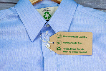 Made with recycled materials shirt with sustainable fashion care label, fashion wash cold, line...