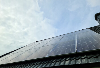 View at new solar panels on the roof of a residential house.