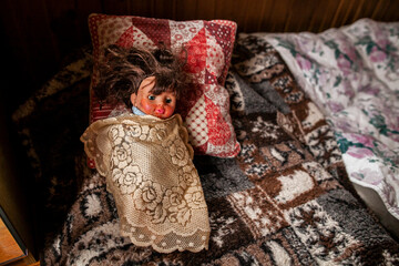 Old plastic vintage doll, medium shot, top and side shot