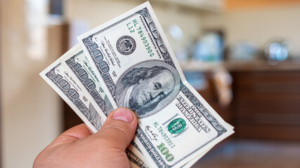 three hundred american dollars in your hand